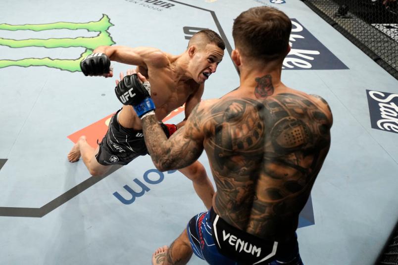Kai Kara-France of New Zealand punches Cody Garbrandt in their flyweight bout during the UFC 269 on December 11, 2021 in Las Vegas, Nevada. (Photo by Jeff Bottari/Zuffa LLC)