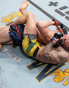 Renato Moicano of Brazil submits Alexander Hernandez in their lightweight fight during the UFC 271 event at Toyota Center on February 12, 2022 in Houston, Texas. (Photo by Josh Hedges/Zuffa LLC)