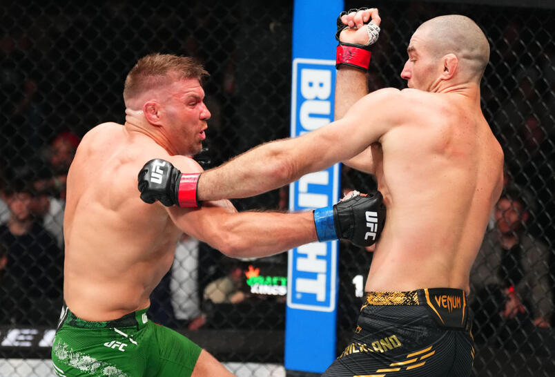 Dricus Du Plessis of South Africa punches Sean Strickland in a UFC middleweight championship bout during the UFC 297 event at Scotiabank Arena on January 20, 2024 in Toronto, Ontario. (Photo by Jeff Bottari/Zuffa LLC)